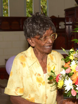 CENTENARIAN Ernesta Smith sharing a joking with Calvin Watson, who presented her with a bouquet at the Whitehall Methodist Church. (Picture by Christoff Griffith)