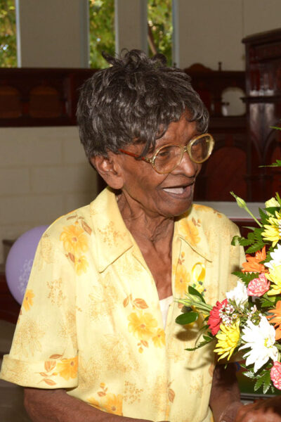 CENTENARIAN Ernesta Smith sharing a joking with Calvin Watson, who presented her with a bouquet at the Whitehall Methodist Church. (Picture by Christoff Griffith)